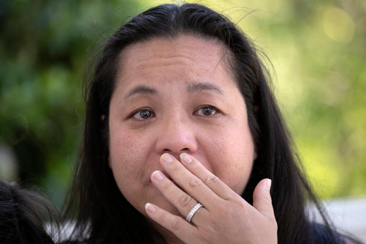 Jennifer Daly sits on her front porch as she recounts the ordeal of almost losing her daughter 12-year-old daughter Juliet to the CCP virus, in Covington, La., on April 30, 2020. (Gerald Herbert/AP Photo)