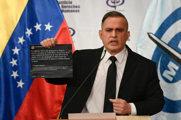 Venezuela's Attorney General Tarek William Saab holds up twitter posts between two members of the opposition, Humberto Calderon and Yon Goicoechea, during a press conference regarding what the government calls a failed attack to overthrowing President Nicolás Maduro in Caracas, Venezuela, on May 4, 2020. (Matias Delacroix/AP Photo)