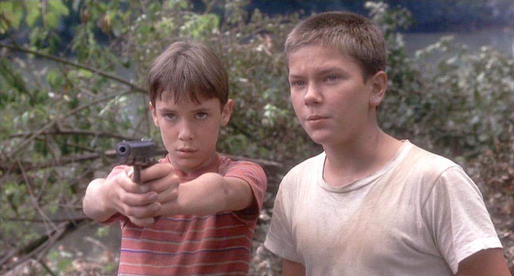 Gordie Lachance (Wil Wheaton, L) and Chris Chambers (River Phoenix) fend off the older gang of bullies in “Stand by Me.” (Columbia Pictures)