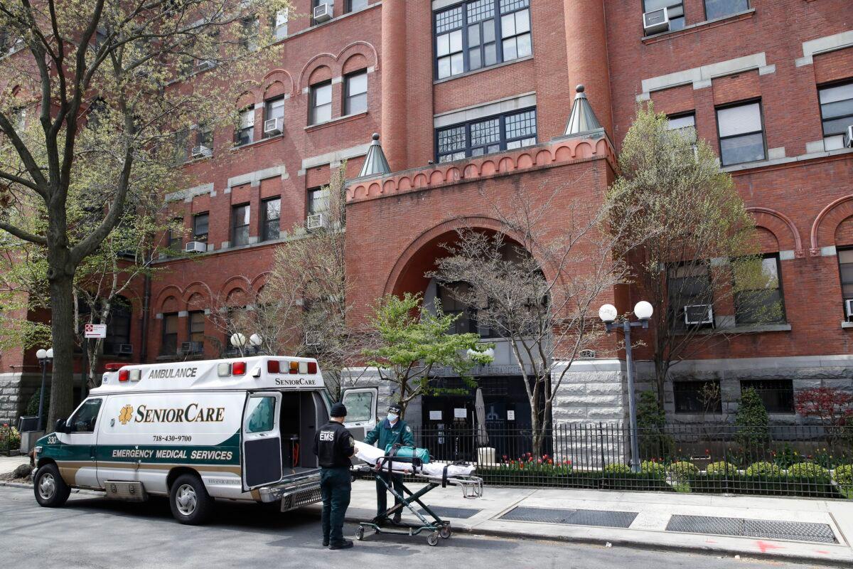 Emergency medical workers arrive at Cobble Hill Health Center in the Brooklyn borough of New York, on April 17, 2020. (John Minchillo/AP Photo)