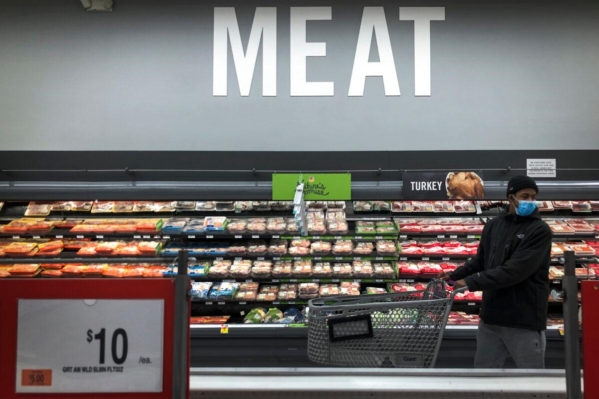 A man shops in the meat section at a grocery store in Washington on April 28, 2020. (Drew Angerer/Getty Images)
