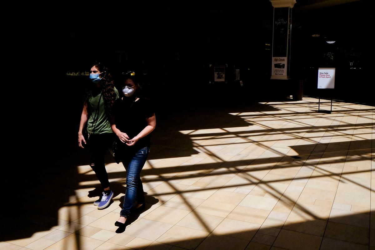 Shoppers walk inside of the Greenwood Park Mall in Greenwood, Ind., on May 4, 2020. (Darron Cummings/AP Photo)
