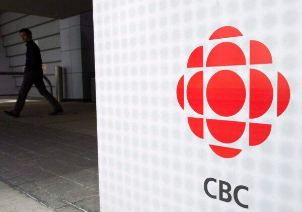 A man leaves the CBC building in Toronto in a file photo. (The Canadian Press/Nathan Denette)