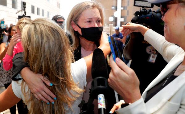 Salon owner Shelley Luther hugs supporters after she was released from jail in Dallas, Texas, on May 7, 2020. (LM Otero/AP)