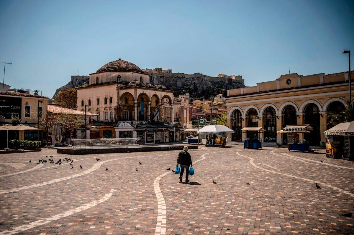 A man walks through the empty Monastiraki square, in central Athens, Greece, on April 9, 2020. (Angelos Tzortzinis/AFP/Getty Images)