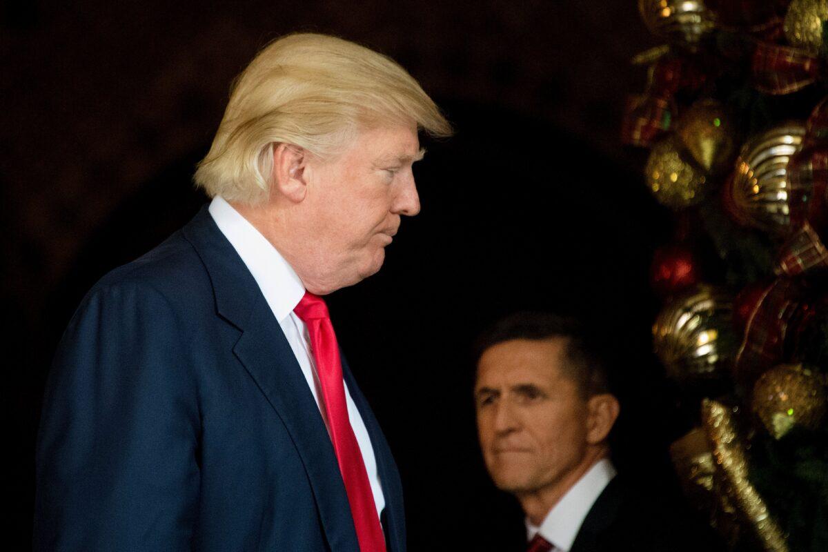 President-elect Donald Trump, left, stands with National Security Adviser Lt. General Michael Flynn at Mar-a-Lago in Palm Beach, Florida, where he is holding meetings on Dec. 21, 2016. (Jim Watson/AFP via Getty Images)
