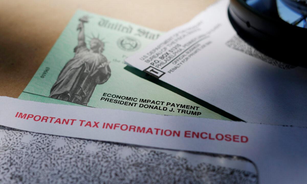 Then-President Donald Trump's name is seen on a stimulus check issued by the IRS to help combat the adverse economic effects of the COVID-19 outbreak, in San Antonio, Texas, on April 23, 2020. (Eric Gay/AP Photo)