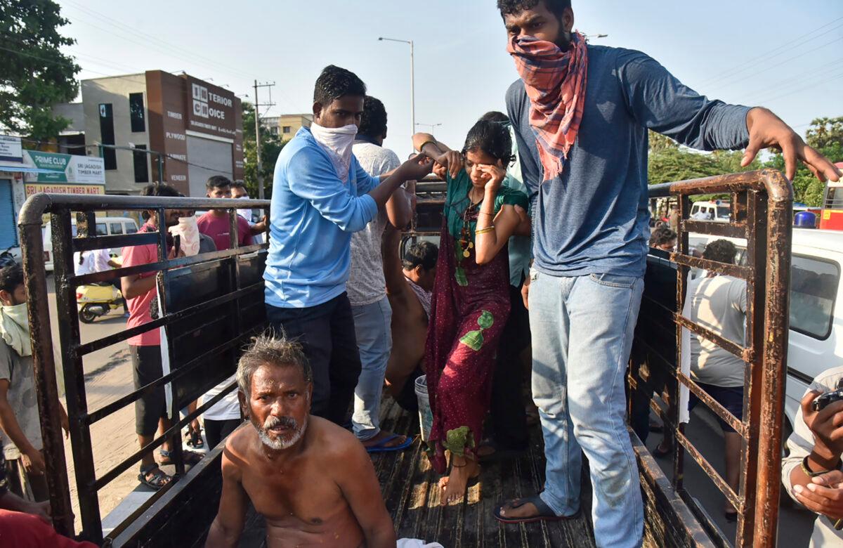 People affected by a chemical gas leak are carried out of a truck to an ambulance in Vishakhapatnam, India, on May 7, 2020. (AP Photo)