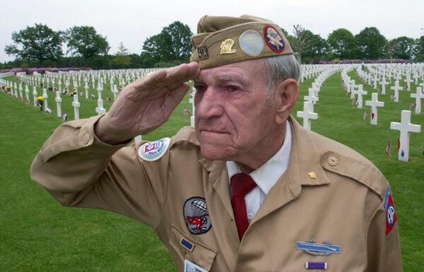 World War II veteran Corporal technician Harry Hudec of Cleveland, Ohio, salutes as the last post is played as he attends the 60-year commemoration service ahead of Memorial Day at the Netherlands American Cemetery in Margraten, southern Netherlands, on May 30, 2004. (Peter Dejong/File Photo/AP Photo)