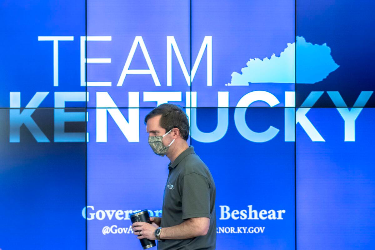 Kentucky Gov. Andy Beshear walks to the podium during a media conference to provide an update on the COVID-19 pandemic,  in Frankfort, Ky. on May 3, 2020. (Ryan C. Hermens/Lexington Herald-Leader via AP)