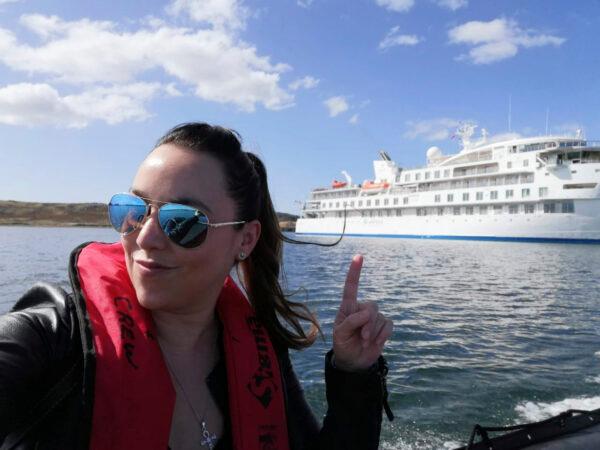 Carolina Vasquez rides a tender in the Falkland Islands, as a crew member on board the Greg Mortimer. Vasquez has been stuck in a cruise cabin with no windows and COVID-19. The ship is floating off the coast of Uruguay. (Carolina Vasquez/AP)
