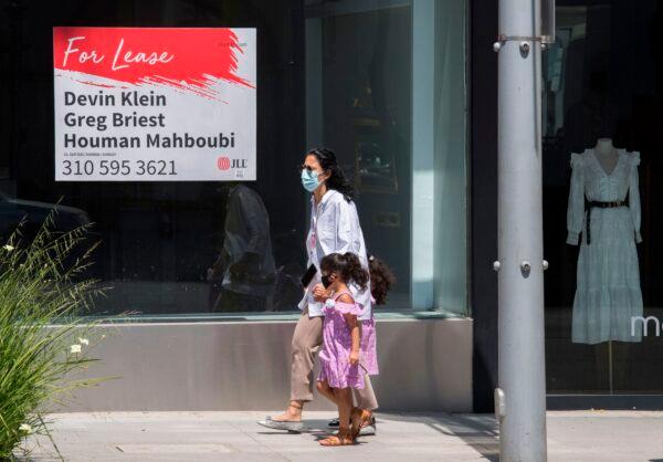 People walk past empty stores and restaurants closed due to impact of the CCP virus in Beverly Hills, California, on May 8, 2020. (Mark Ralston/AFP via Getty Images)