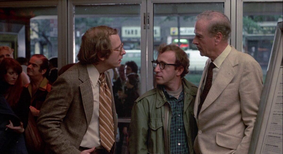 (L–R) Russell Horton, Woody Allen, and Marshall McLuhan star in “Annie Hall.” (United Artists)