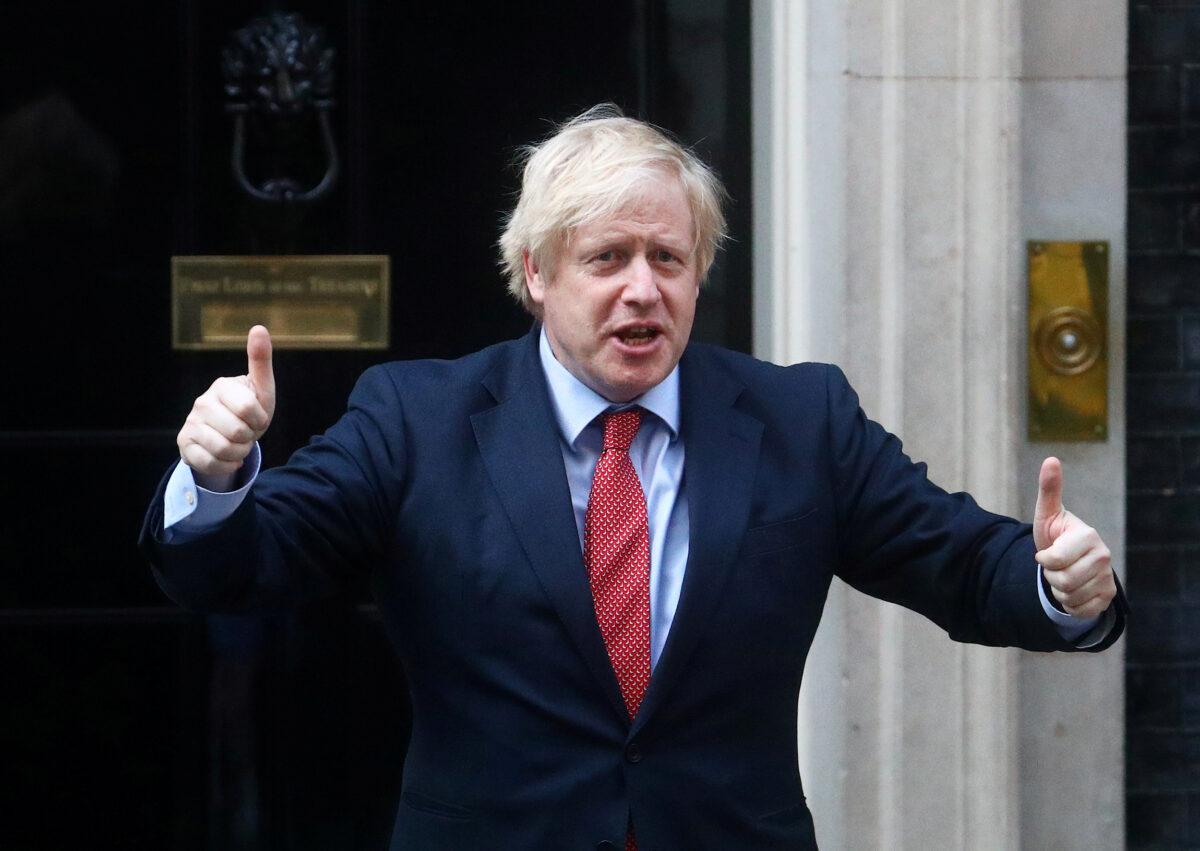 Britain's Prime Minister Boris Johnson reacts outside 10 Downing Street during the Clap for our Carers campaign in support of the NHS, following the outbreak of the CCP virus disease in London, Britain, on May 7, 2020. (Hannah McKay/Reuters)