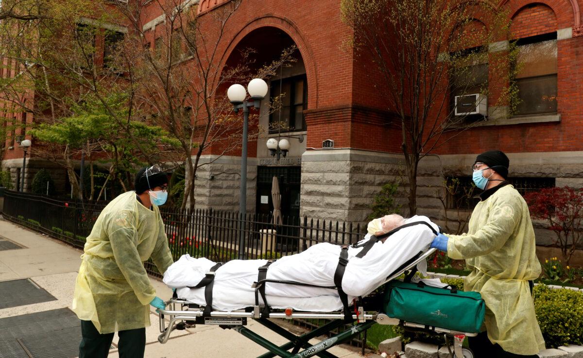 Emergency Medical Technicians (EMTs) wheel a man out of the Cobble Hill Health Center nursing home during an ongoing outbreak of the CCP virus in the Brooklyn borough of New York on April 17, 2020. (Lucas Jackson/Reuters)