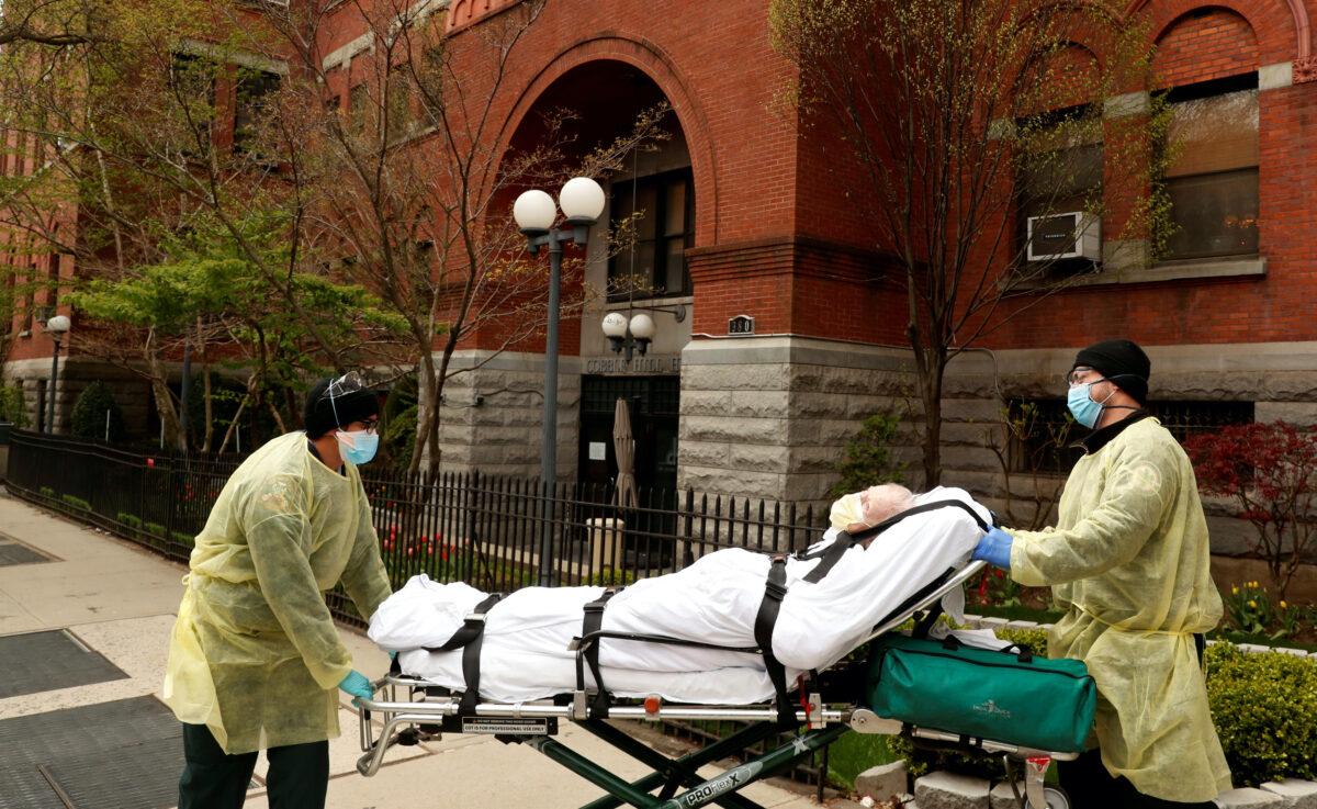 Emergency medical technicians wheel a man out of the Cobble Hill Health Center nursing home during an ongoing outbreak of the CCP virus in Brooklyn, N.Y., on April 17, 2020. (Lucas Jackson/Reuters)