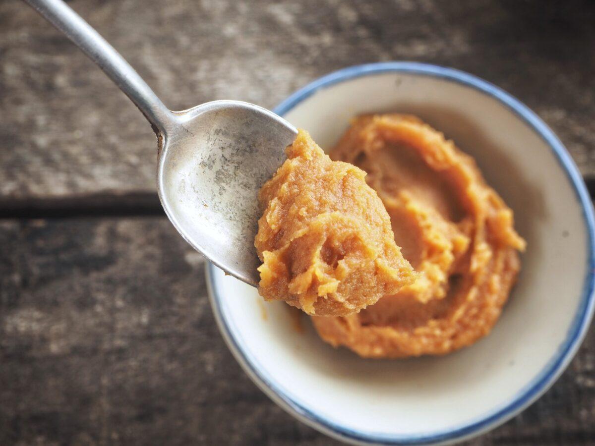 Salty, umami-rich miso paste, made from fermenting soybeans or rice, makes a perfect match for coconut milk. (Successo Images/Shutterstock)
