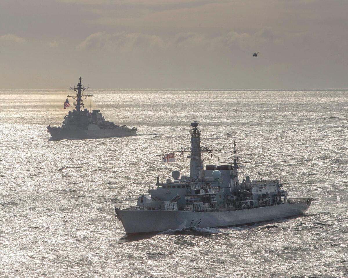 The Royal Navy Type-23 Duke-class frigate HMS Kent (F78), front, and the Arleigh Burke-class guided-missile destroyer USS Donald Cook (DDG 75) conduct joint operations to ensure maritime security in the Arctic Ocean, May 5, 2020. (U.S. Navy photo courtesy of the Royal Navy/Dan Rosenbaum/Released)
