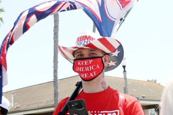 A protester attends a demonstration calling for the rapid reopening of California, in Huntington Beach, on May 9, 2020. (Jamie Joseph/The Epoch Times)