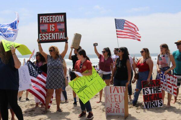 Protesters call for the rapid reopening of California, in Huntington Beach, on May 9, 2020. (Jamie Joseph/The Epoch Times)