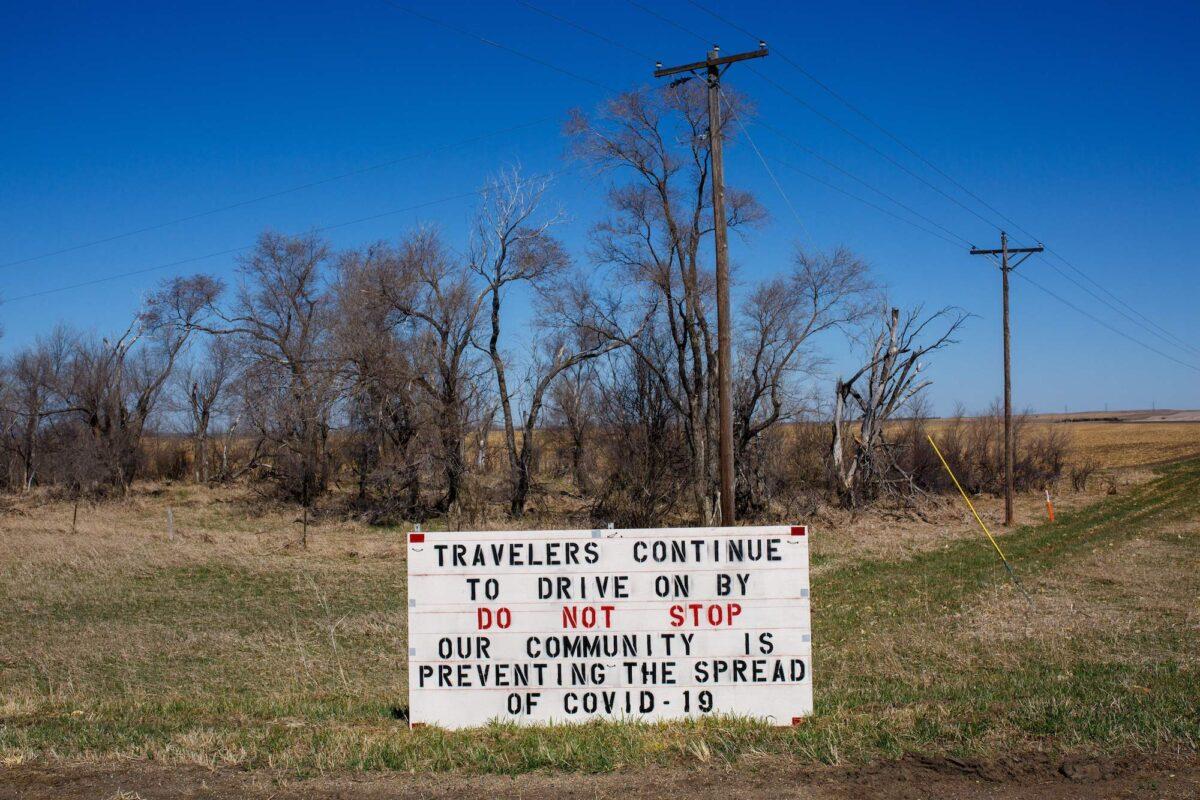 A sign asks travelers not to stop, in an effort to prevent the spread of COVID-19, in a community near in Lower Brule, S.D., on April 22, 2020. (Kerem Yucel/AFP/Getty Images)