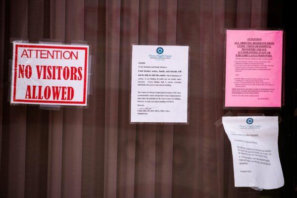 Information regarding new rules about visiting a nursing home are taped to a window during an ongoing outbreak of the CCP virus in the Brooklyn borough of New York. (Lucas Jackson/Reuters)