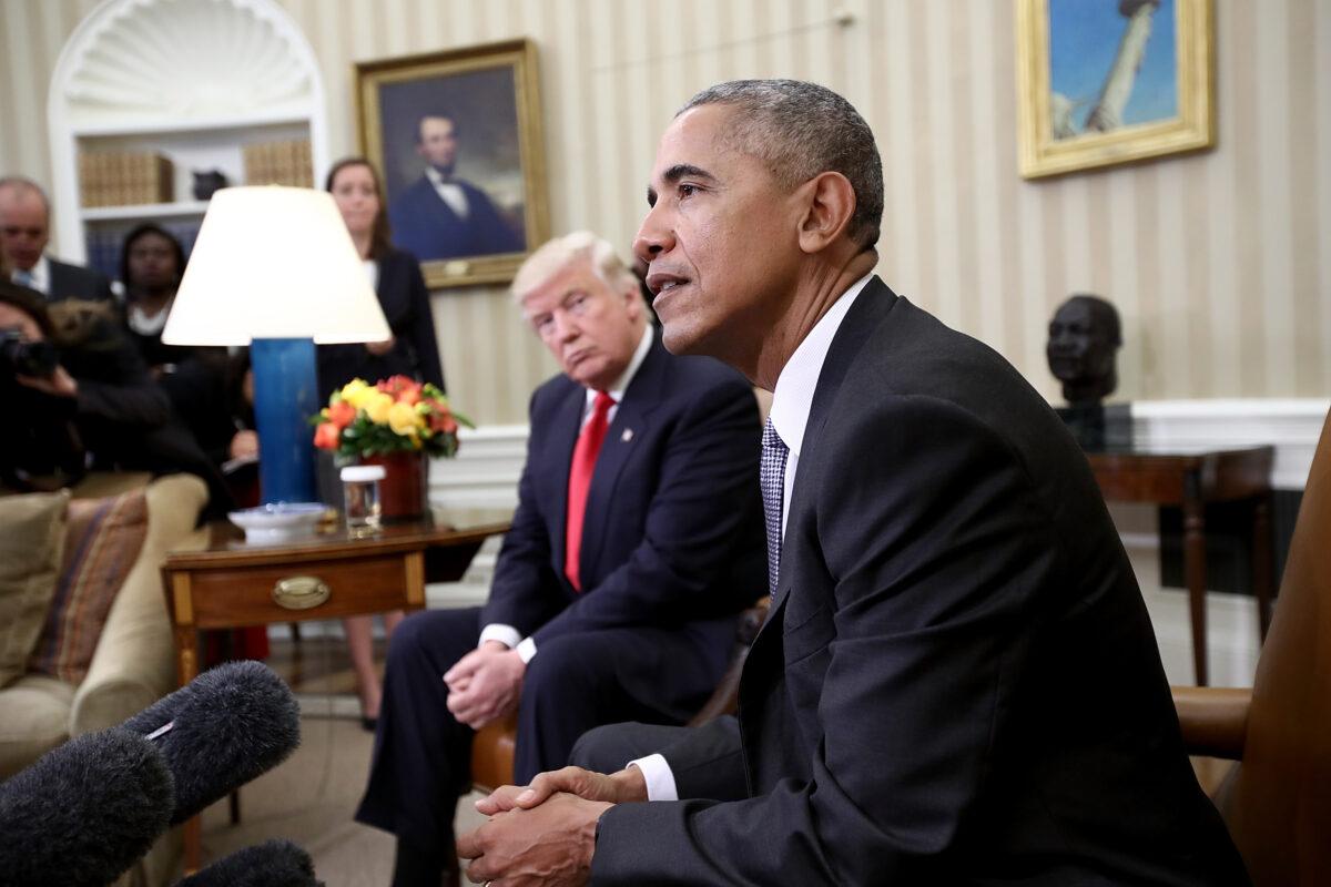 President-elect Donald Trump listens as President Barack Obama speaks during a meeting in the Oval Office in Washington on Nov. 10, 2016. (Saul Loeb/Pool/Getty Images)