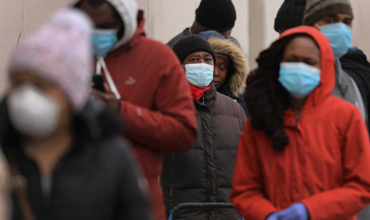 People wait in line to enter a supermarket that has limited the number of shoppers due to the CCP virus in the Brooklyn borough of New York City on April 10, 2020. (Spencer Platt/Getty Images)