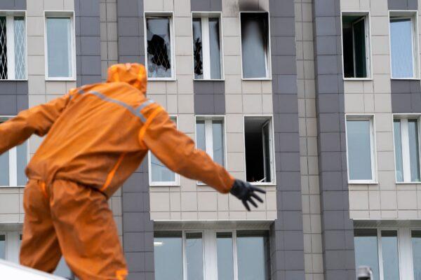 A Russian Emergency Situation worker attends the scene of a fire at St. George Hospital in St. Petersburg, Russia, on May 12, 2020. (Dmitry Lovetsky/AP Photo)