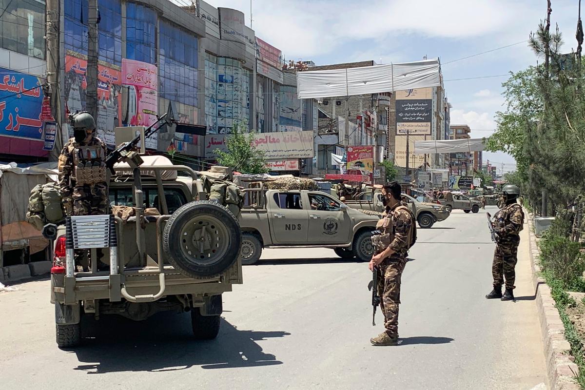 Afghan security personnel arrive at the site where gunmen attacked, in Kabul, Afghanistan, on May 12, 2020. (Rahmat Gul/AP Photo)