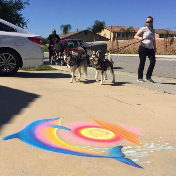 Pedestrians pass one of Gayle DuRivage's chalk drawings in Menifee, Calif. (Courtesy of Gayle DuRivage)