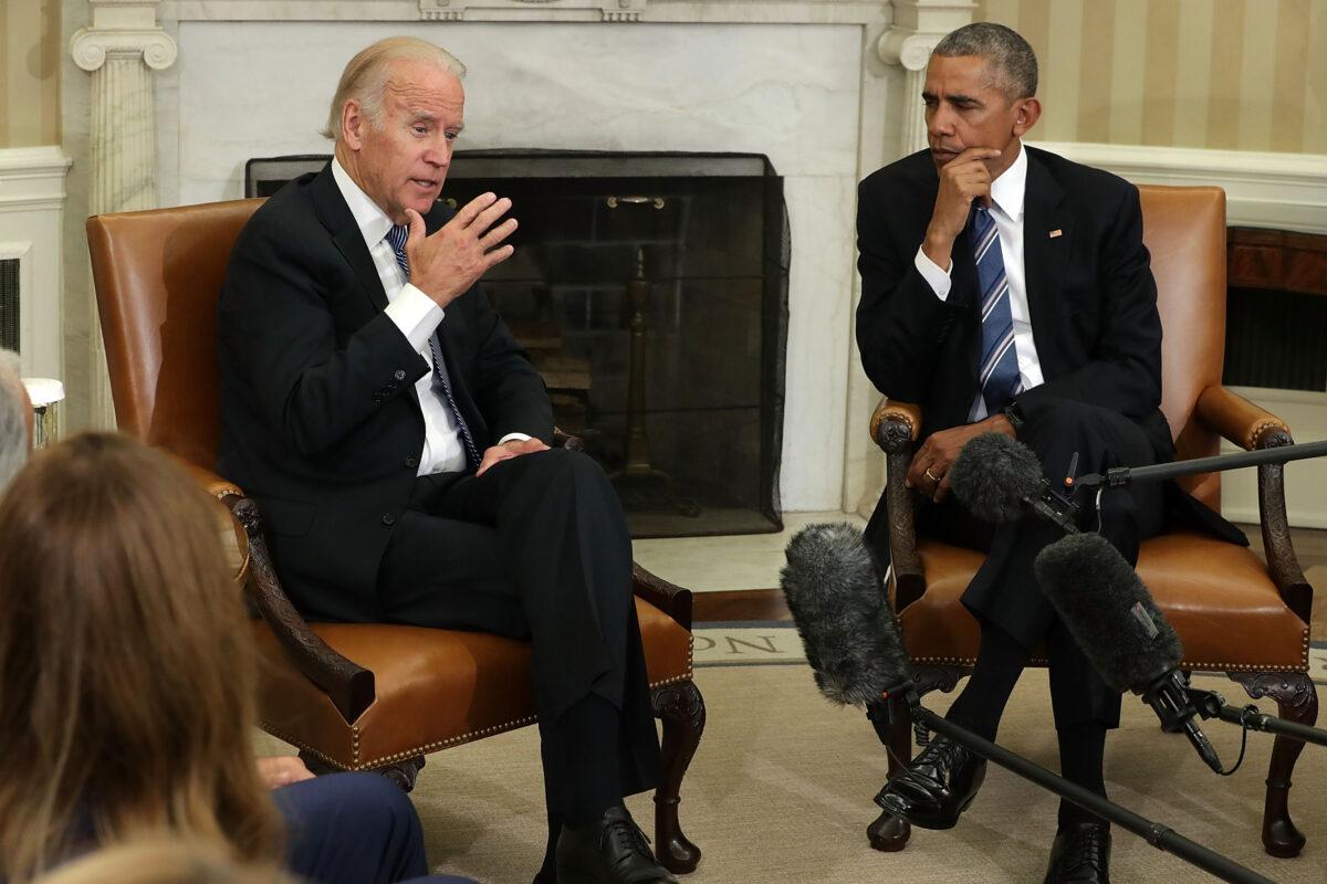 Then-Vice President Joseph Biden, left, speaks as President Barack Obama listens in Washington on Oct. 17, 2016. (Alex Wong/Getty Images)