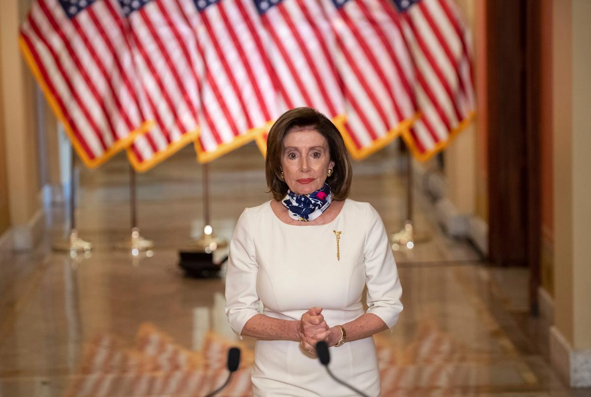 House Speaker Nancy Pelosi (D-Calif.) speaks about Democrats' newly unveiled $3 trillion package in Washington on May 12, 2020. (Saul Loeb/Pool via AP)