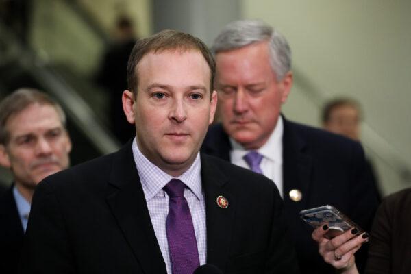 Rep. Lee Zeldin (R-N.Y.) speaks to media outlets while other impeachment defense team advisers look on, at the Capitol on Jan. 27, 2020. (Charlotte Cuthbertson/The Epoch Times)