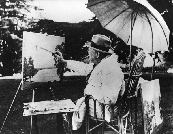 Winston Churchill painting beside Lake Geneva. (Fox Photos/Getty Images)