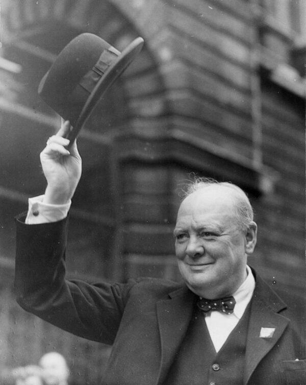British statesman and prime minister Winston Churchill waving to the crowds at Downing Street on August 19, 1941. (Keystone/Getty Images)