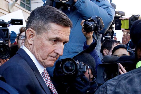 Former national security adviser Lt. Gen. Michael Flynn passes by members of the media as he departs after his sentencing was delayed at U.S. District Court in Washington on Dec. 18, 2018. (Joshua Roberts/Reuters)