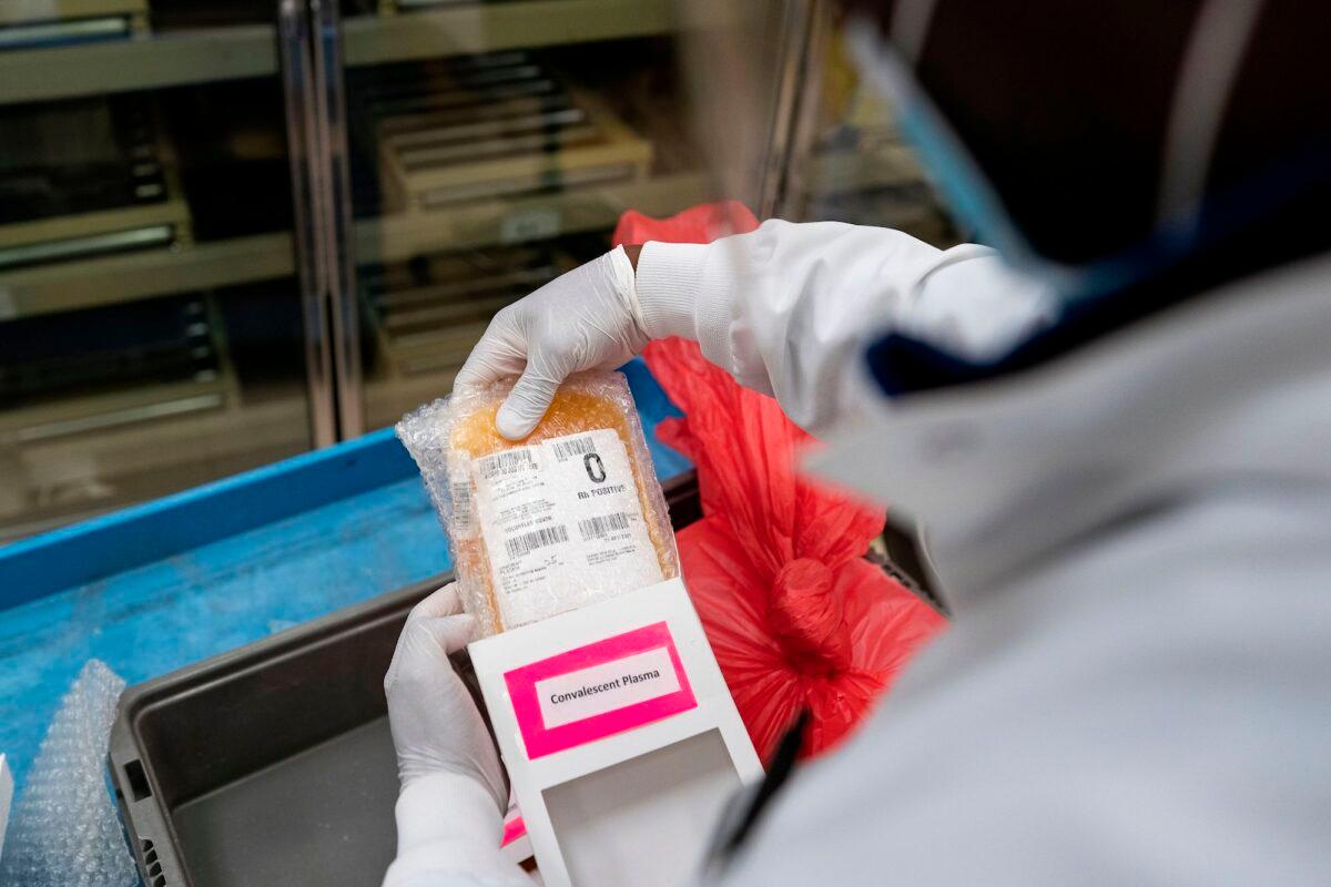 A lab technician freeze packs donated convalescent plasma donated by recovered COVID-19 patients for shipping to local hospitals at Inova Blood Services, in Dulles, Va., on April 22, 2020. (Alex Edelman/AFP/Getty Images)