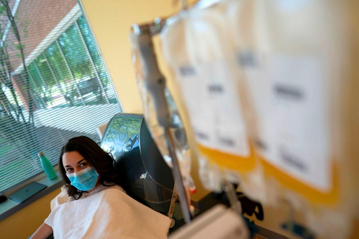Mckinley Edelman, a recovered COVID-19 patient, donates plasma at MedStar Georgetown University Hospital in Dulles, Va., on April 22, 2020. (Alex Edelman/AFP/Getty Images)