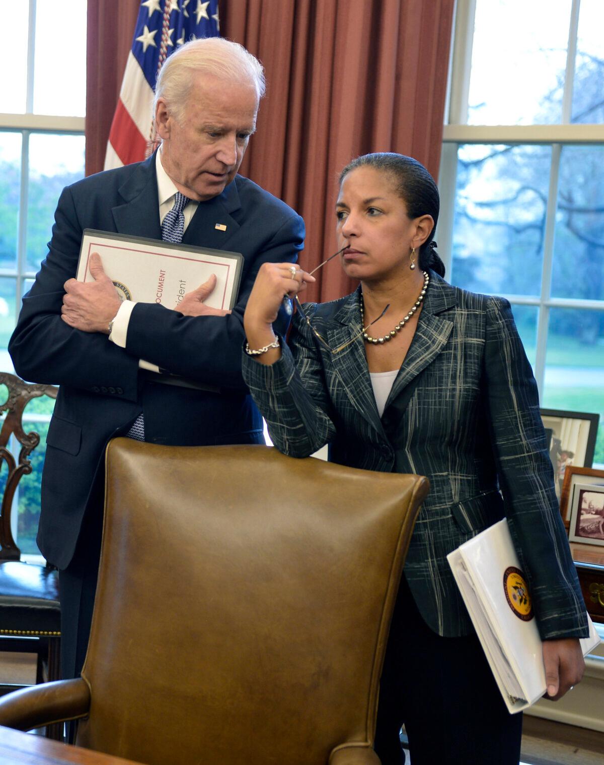 Then-Vice President Joe Biden (L) and then-National Security Advisor Susan Rice talk as then-President Barack Obama and then-Iraqi Prime Minister Haider al-Abadi brief the press after a bilateral meeting in the Oval Office of the White House in Washington on April 14, 2015. (Mike Theiler/Getty Images)