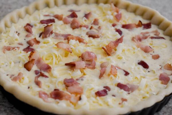Fill the crust with the custard mixture, bacon, and cheese. (Photo by Audrey Le Goff)