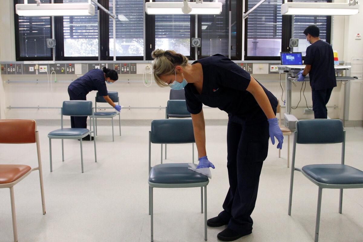 Nurses wipe down the clinical assessment room, St. George Hospital, Sydney, NSW Australia May 15, 2020. (Lisa Maree Williams/Getty Images)