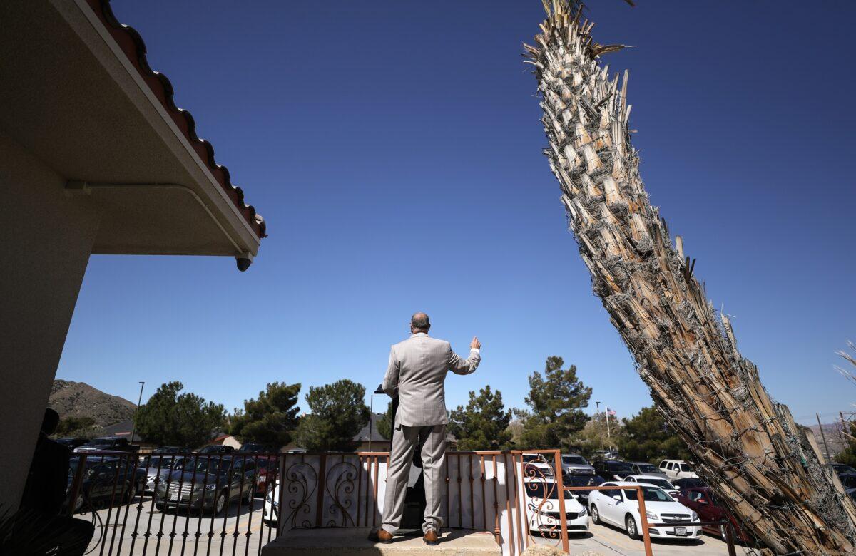 Pastor Jerel Hagerman conducts a drive-in ‘car church’ Easter service in the parking lot of Joshua Springs Calvary Chapel amidst the coronavirus pandemic in Yucca Valley, Calif. on April 12, 2020. (Mario Tama/Getty Images)