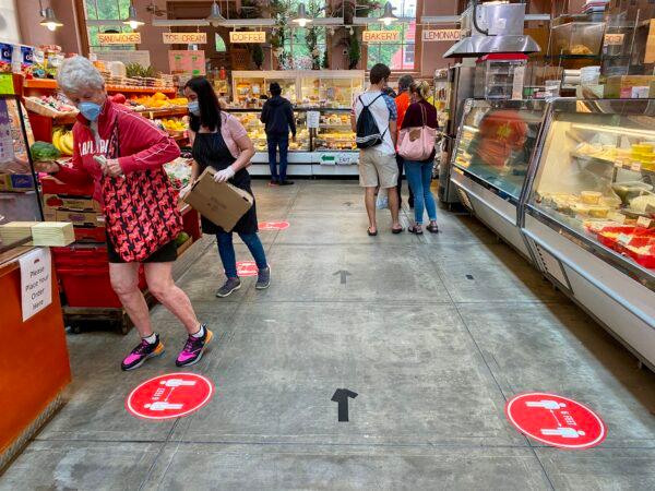 Shoppers at Eastern Market in Washington on May 17, 2020. (Daniel Slim/AFP via Getty Images)