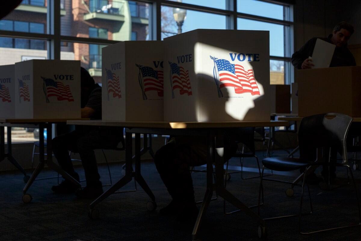Voters cast their ballots at the Ferndale Public Library in Ferndale, Mich., on March 10, 2020. (Elaine Cromie/Getty Images)