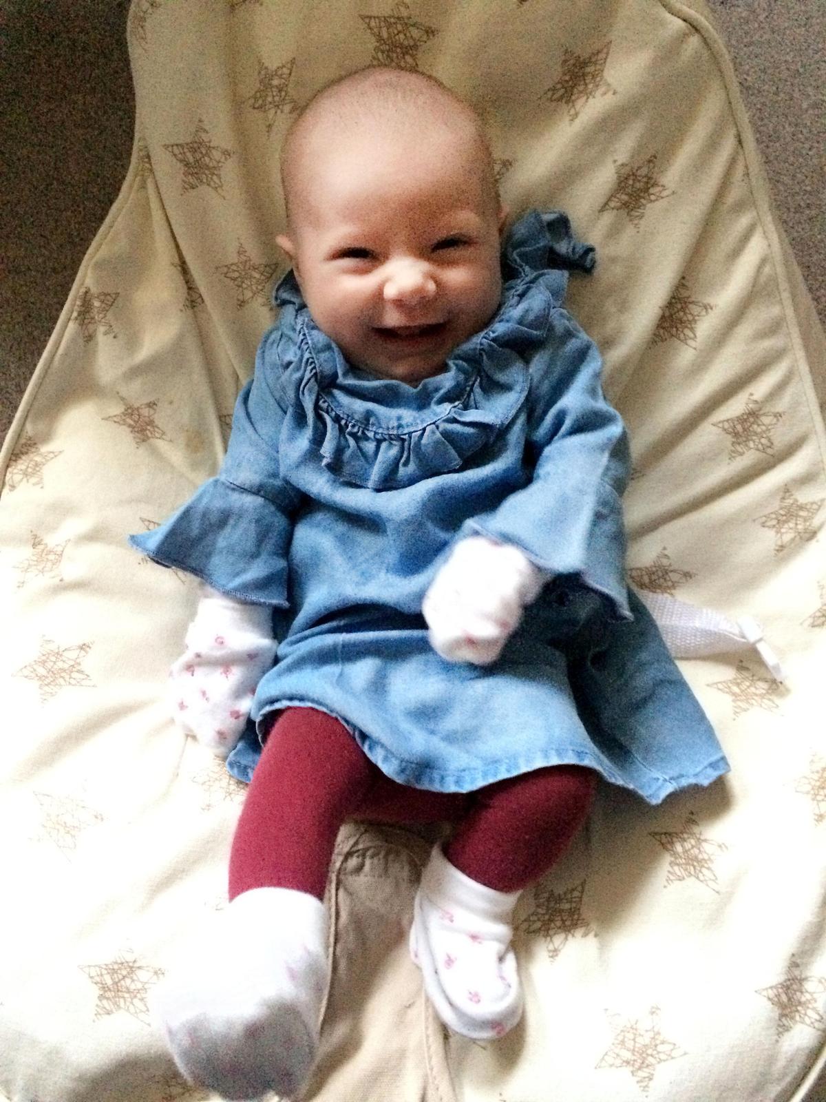 Danielle McSherry-Schee's daughter Isabella having a good laugh (Caters News)