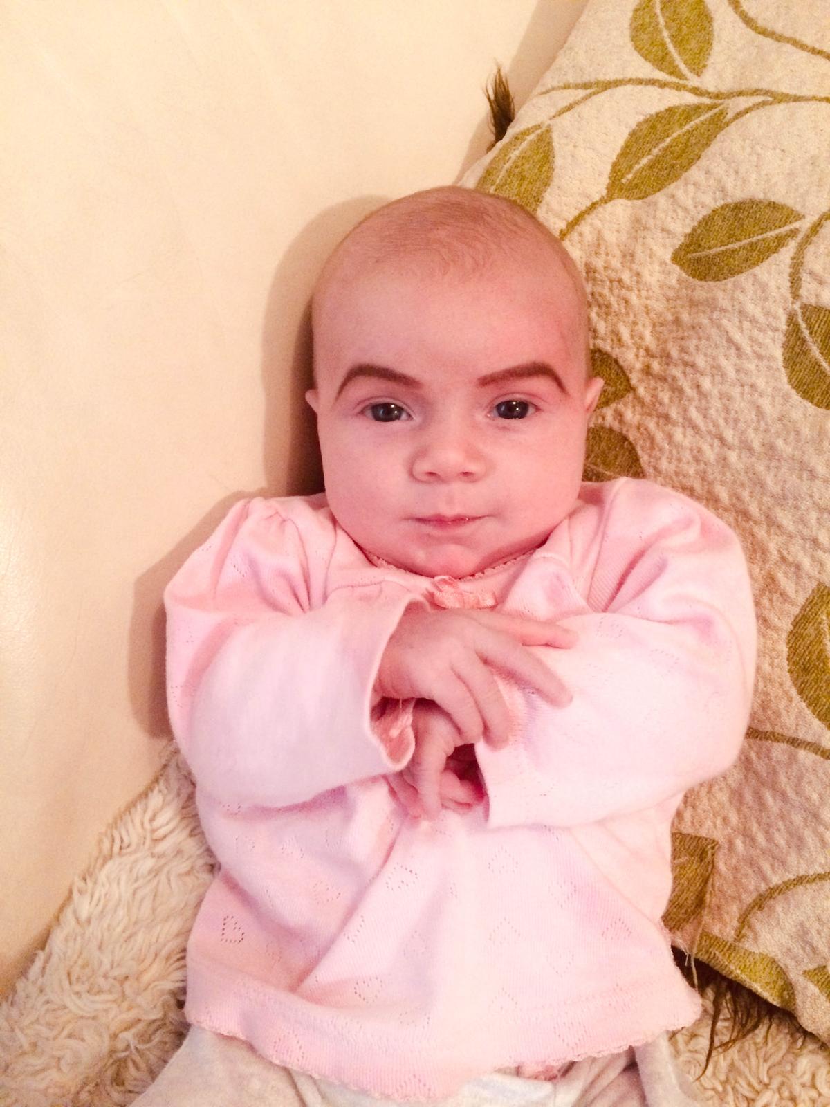 Danielle McSherry-Schee's daughter Isabella with eyebrows, courtesy of Mom (Caters News)