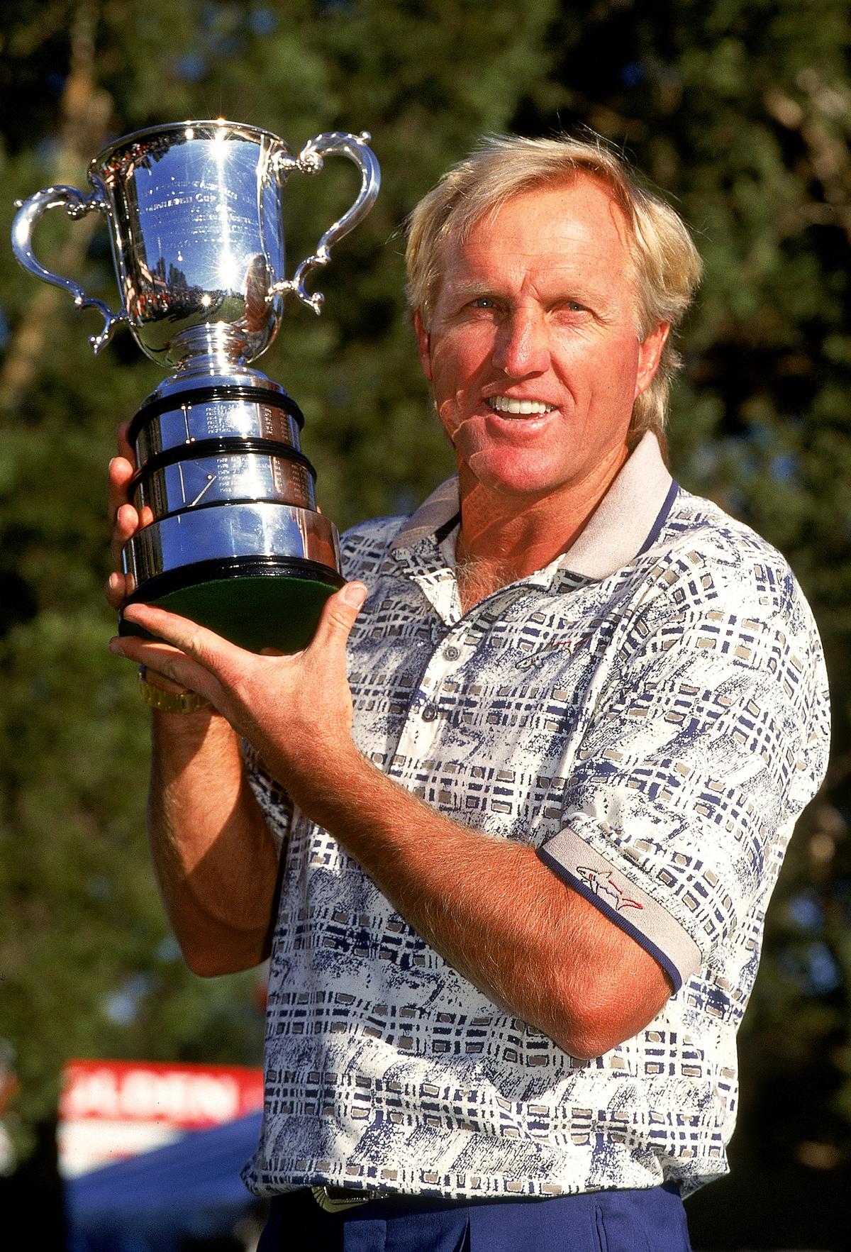Greg Norman, of Australia, holds aloft the trophy after winning the Australian Open played at the Lakes Golf Course on Feb. 4, 2000, in Sydney, Australia. (Getty Images)