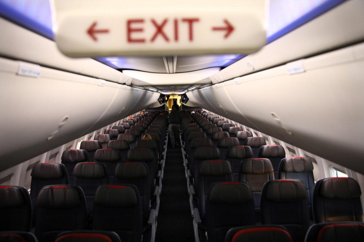 Rows of empty seats of an American Airlines flight in Washington, on March 18, 2020. (Carlos Barria/Reuters)