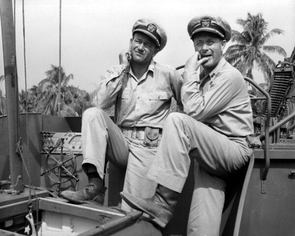 John Wayne (L) and Robert Montgomery in “They Were Expendable.” (MGM)